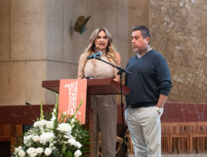 Jennifer Magallon speaks to the crowd during OneLife LA on Jan. 18 standing next to her husband, George. (Victor Alemán)