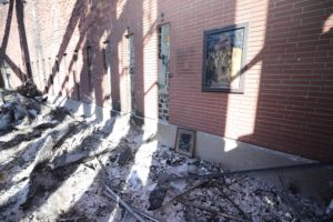 A melted photograph of Pope Francis hangs on the wall inside the destroyed Corpus Christi Church in Pacific Palisades. (OSV News photo/Bob Roller)