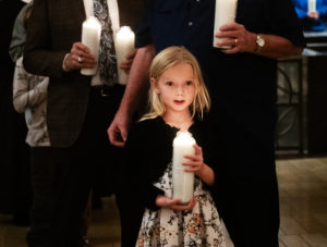 A young girl brings up a candle symbolizing a baby killed by abortion during the annual Requiem Mass for the Unborn, the conclusion to the OneLife LA celebration at the Cathedral of Our Lady of the Angels on Jan. 18. (Victor Alemán)