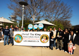 Parishioners from Christ the King Church in Los Angeles pose behind a banner during the OneLife LA event on Jan. 18. (Victor Alemán)