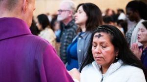 Attendees receive ashes during the Ash Wednesday Mass at the Cathedral of Our Lady of the Angels on March 5, the first day of Lent. (Victor Alemán)