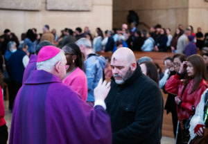 Los Angeles Archbishop José H. Gomez offers ashes during the Ash Wednesday Mass at the Cathedral of Our Lady of the Angels on March 5, the first day of Lent. (Victor Alemán)