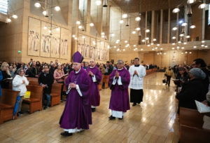 Los Angeles Archbishop José H. Gomez processes in with fellow priests during the Ash Wednesday Mass at the Cathedral of Our Lady of the Angels on March 5, the first day of Lent. (Victor Alemán)