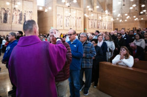 Attendees receive ashes during the Ash Wednesday Mass at the Cathedral of Our Lady of the Angels on March 5, the first day of Lent. (Victor Alemán)