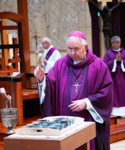 Los Angeles Archbishop José H. Gomez blesses the ashes used during the Ash Wednesday Mass at the Cathedral of Our Lady of the Angels on March 5, the first day of Lent. (Victor Alemán)