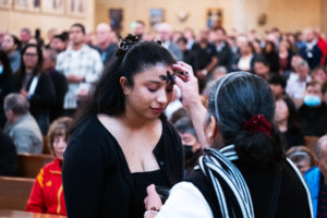 Attendees receive ashes during the Ash Wednesday Mass at the Cathedral of Our Lady of the Angels on March 5, the first day of Lent. (Victor Alemán)