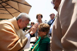 Father Joseph Cruz offers a first blessing to his family following the ordination Mass at the Cathedral of Our Lady of the Angels on May 31. (Victor Alemán)