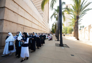 Attendees process into the Cathedral of Our Lady of the Angels on June 22 for Mass during the National Eucharistic Pilgrimage. ((Victor Alemán)