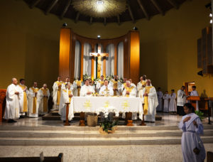 Bishop Andrew H. Cozzens of Crookston, Minn. center, and Cardinal Christophe Pierre, papal nuncio to the United States, left next to Cozzens, celebrate Mass at Mission San Gabriel Arcángel on June 21 as part of the National Eucharistic Pilgrimage. (Victor Alemán)