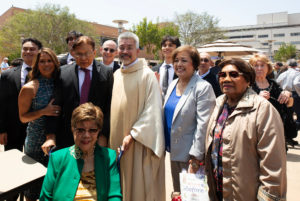 Father Joseph Cruz poses with family and loved ones following the new priests ordination Mass on May 31. (Victor Alemán)