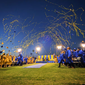 Graduates throw their caps as confetti streamers fly into the air during Bishop Amat High School’s commencement ceremony on May 30. (Bishop Amat High School)