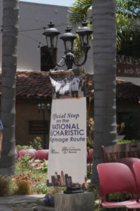 A sign designates Mission Basilica San Buenaventura as an official stop during the National Eucharistic Pilgrimage’s final weekend. (Katie Trejo)
