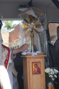 Bishop Sławomir Szkredka carries the Blessed Sacrament back to the National Eucharistic Pilgrimage’s van after Mass on June 20. (Katie Trejo)