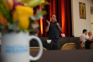 Tom Costanzo, who lost his home in the Eaton Fire, speaks during a pre-Mass dinner at Sacred Heart Church in Altadena  during the National Eucharistic Pilgrimage's stop on June 20. (Katie Trejo)