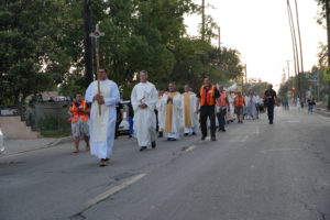 A Eucharistic procession as part of the National Eucharistic Pilgrimage travels through the streets of Altadena that were burned in the Eaton Fire on June 20. (Katie Trejo)