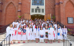 Graduates of Sacred Heart High School in Lincoln Heights pose in their cap and gowns. (Sacred Heart High School)