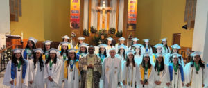 Graduates at San Gabriel Mission High School pose with pastor Father Paschal Chukwuemeka Amagba. (San Gabriel Mission High School)