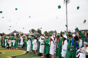 Graduates throw their caps into the air at the end of St. Joseph High School in Santa Maria's commencement ceremony on June 5. (St. Joseph High School)