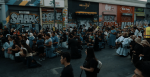 Hundreds kneel in front of the Blessed Sacrament during a Eucharistic procession through Skid Row in downtown Los Angeles on July 19. (Archdiocese of Los Angeles)