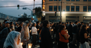 Those in the procession carry candles at dusk during a Eucharistic procession through Skid Row in downtown Los Angeles on July 19. (Archdiocese of Los Angeles)