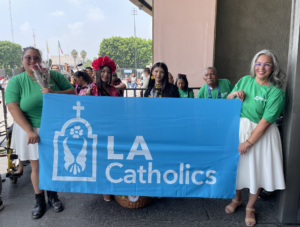 LA Catholics hold up a banner outside the Basilica of Our Lady of Guadalupe in Mexico City during LA Catholics’ annual pilgrimage to Mexico on July 4. (Adrian Marquez Alarcon)