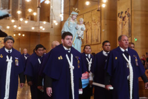 The Peruvian ministry organization, La Hermandad del Señor de los Milagros, carries the Virgin Mary statue in during the “One Mother, Many Peoples” Mass at the Cathedral of Our Lady of the Angels on Sept. 6, which celebrated the diverse cultures, organizations, and ethnic ministries in the Archdiocese of Los Angeles. (Reese Cuevas/Archdiocese of Los Angeles)