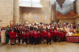Archbishop José H. Gomez poses with attendees following the “One Mother, Many Peoples” Mass at the Cathedral of Our Lady of the Angels on Sept. 6, which celebrated the diverse cultures, organizations, and ethnic ministries in the Archdiocese of Los Angeles. (Reese Cuevas/Archdiocese of Los Angeles)