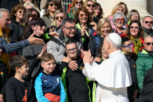 Pope Leo XIV greets a group of pilgrims at the end of an audience for the Jubilee of Migrants and the Jubilee of the Missions Oct. 4, 2025, in St. Peter's Square at the Vatican. (CNS photo/Vatican Media)