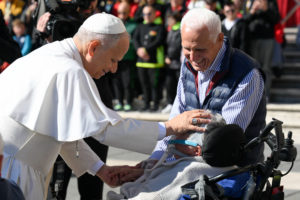 Pope Leo XIV blesses a person who is ill at the end of an audience for the Jubilee of Migrants and the Jubilee of the Missions Oct. 4, 2025, in St. Peter's Square at the Vatican. (CNS photo/Vatican Media)