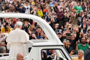 Pope Leo XIV greets people from the popemobile as he rides around St. Peter’s Square following Mass for the Jubilee of Migrants and the Jubilee of the Missions in St. Peter’s Square at the Vatican Oct. 5, 2025. (CNS photo/Lola Gomez)