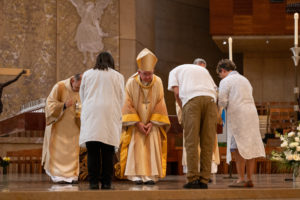 Archbishop José H. Gomez bows to those bringing up the gifts during the Healthcare Professional Mass, known as the White Mass, at the Cathedral of Our Lady of the Angels on Oct. 12. (Lizzie Friedrich)
