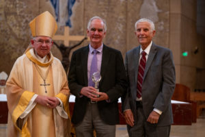 Archbishop José H. Gomez poses with Dr. Terry Schick, who received the Catholic Doctor of the Year Award, and Thomas Liautaud, Mission Doctors Association's president, during the Healthcare Professionals Mass, known as the White Mass, at the Cathedral of Our Lady of the Angels on Oct. 12. (Lizzie Friedrich)