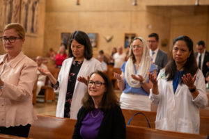 Attendees pray during the Healthcare Professionals Mass, known as the White Mass, at the Cathedral of Our Lady of the Angels on Oct. 12. (Lizzie Friedrich)