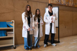 Volunteers hand out programs for the Healthcare Professionals Mass, known as the White Mass, at the Cathedral of Our Lady of the Angels on Oct. 12. (Lizzie Friedrich)