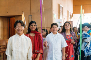 Students from across the Archdiocese of Los Angeles get ready to process in to begin the annual Missionary Childhood Association (MCA) Youth Appreciation Mass at the Cathedral of Our Lady of the Angels on Oct. 15. (Isabel Cacho)