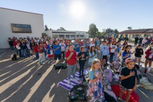 Students and parents recite the Pledge of Allegiance during a Veterans Day event at Holy Angels School in Arcadia on Nov. 10. (Lawrence Lane)
