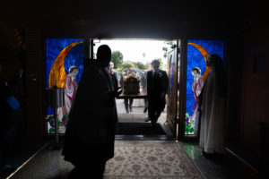 The reliquary of St. Thérèse enters the Sacred Heart Retreat House in Alhambra on Oct. 13 during a U.S. tour of the saint's relics. (Jeffrey Bruno)