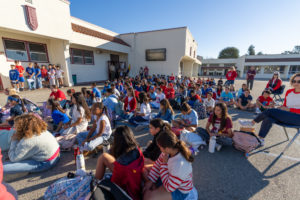 Students and teachers find their seats prior to a Veterans Day event at Holy Angels School in Arcadia on Nov. 10. (Lawrence Lane)