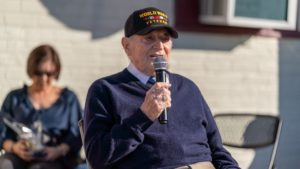 Joe “Peppy” Sciarra, a 100-year-old World War II veteran, speaks to students during a Veterans Day event at Holy Angels School in Arcadia on Nov. 10. (Lawrence Lane)