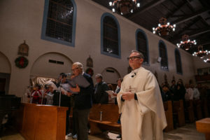Father Gilbert Guzman, pastor of Sacred Heart Church in Altadena, processes in during a Jan. 7 healing Mass on the one-year anniversary of the Eaton Fire. (John Rueda)