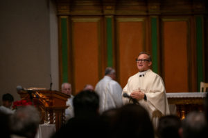 Father Gilbert Guzman, pastor of Sacred Heart Church in Altadena, gives his homily during a Jan. 7 healing Mass on the one-year anniversary of the Eaton Fire. (John Rueda)