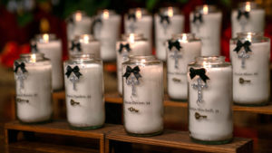 Nineteen candles with the names of each of the victims of the Eaton Fire were lit and placed near the altar at Sacred Heart Church in Altadena during a Jan. 7 healing Mass. (John Rueda)