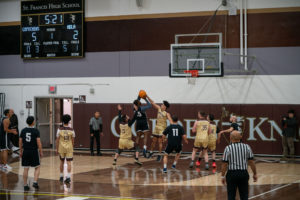 Game action as the Capuchin Franciscans play against the seminarians in the Archdiocese of Los Angeles' annual priests vs. seminarians basketball game, this year on Jan. 18 at St. Francis High School in La Cañada Flintridge. (John Rueda)
