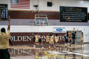 Game action as the Capuchin Franciscans play against the seminarians in the Archdiocese of Los Angeles' annual priests vs. seminarians basketball game, this year on Jan. 18 at St. Francis High School in La Cañada Flintridge. (John Rueda)