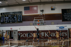 Game action as the Capuchin Franciscans play against the seminarians in the Archdiocese of Los Angeles' annual priests vs. seminarians basketball game, this year on Jan. 18 at St. Francis High School in La Cañada Flintridge. (John Rueda)