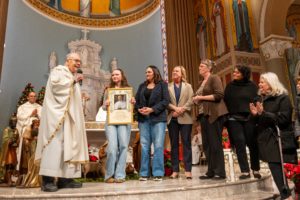 Msgr. Lloyd Torgerson and St. Monica parishioners received a framed apostolic blessing from Pope Leo XIV obtained by Corpus Christi’s Msgr. Liam Kidney as a sign of gratitude for their hospitality after the Palisades Fire. (Elizabeth Friedrich)