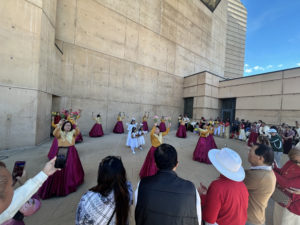 Young people dance in the outdoor plaza of the the Cathedral of Our Lady of the Angels on Jan. 18 for the Feast of Santo Niño Mass. (Carolina Guevara)
