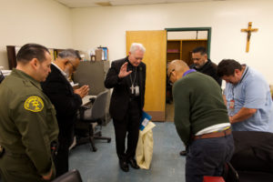 Auxiliary Bishop Matt Elshoff offers blessings as he celebrated Christmas Day Mass with inmates at Men’s Central Jail near downtown LA. (Reese Cuevas)