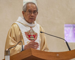 Father Lester Avestruz wears a Santo Niño decorated vestment during a Mass and Sinulog festival held at St. Philomena Church in Carson on Jan. 17. (Juanito Holandez Jr.)
