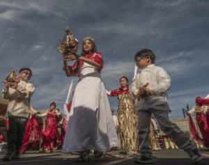 Zyndia Caburog, 12, center, played the role of a princess for a Sinulog dance performance while carrying a Santo Niño statue following a Mass held at St. Philomena Church in Carson on Jan. 17. (Juanito Holandez Jr.)